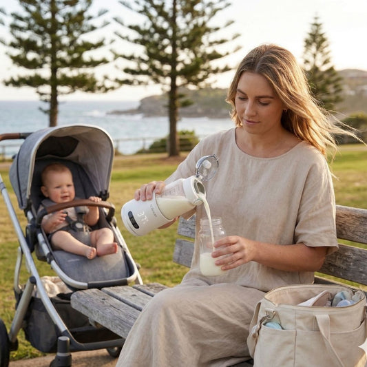 Australian mum warming baby bottle at the park with portable bottle warmer