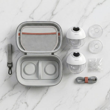 Relievoo Complete Pumping Kit flat lay - carrying case, two wearable breast pump cups, flanges, nipple shields and USB-C cable