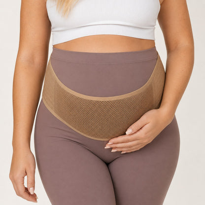Close-up of the breathable mesh Relievoo Pregnancy Belly Band in beige supporting the baby bump