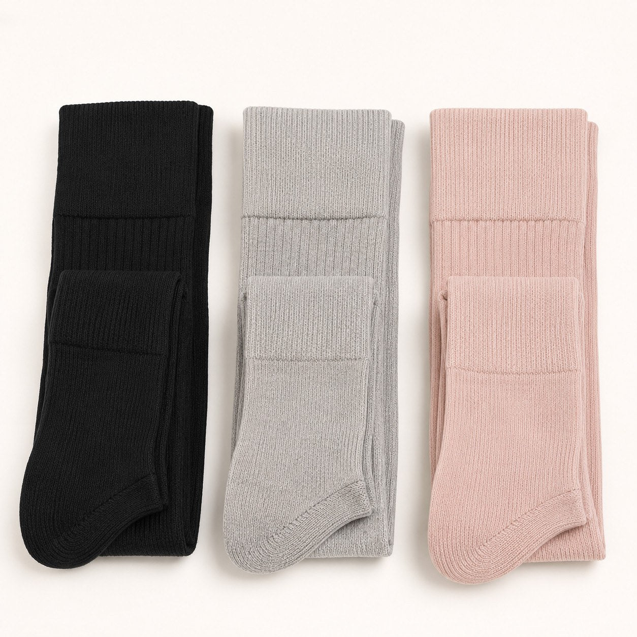 Relievoo Pregnancy Compression Socks shown in three colours — black, grey and pink